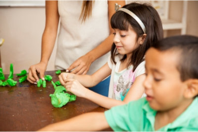 kids in a clay art activity